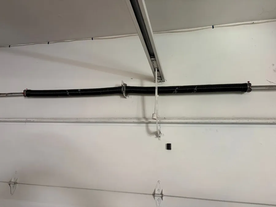 Freshly installed garage door spring by Noah Garage Doors