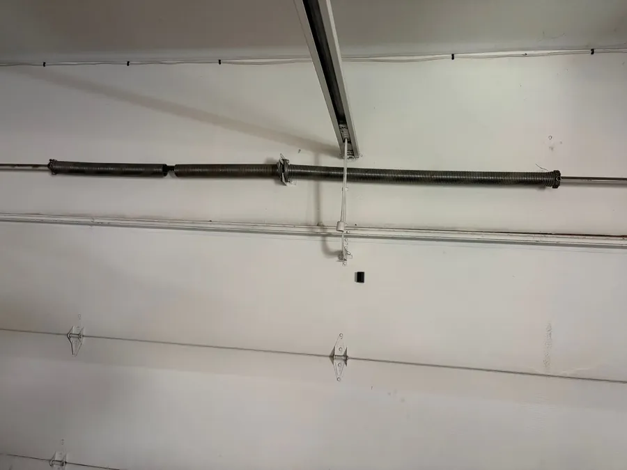 Worn garage door spring before replacement in San Diego