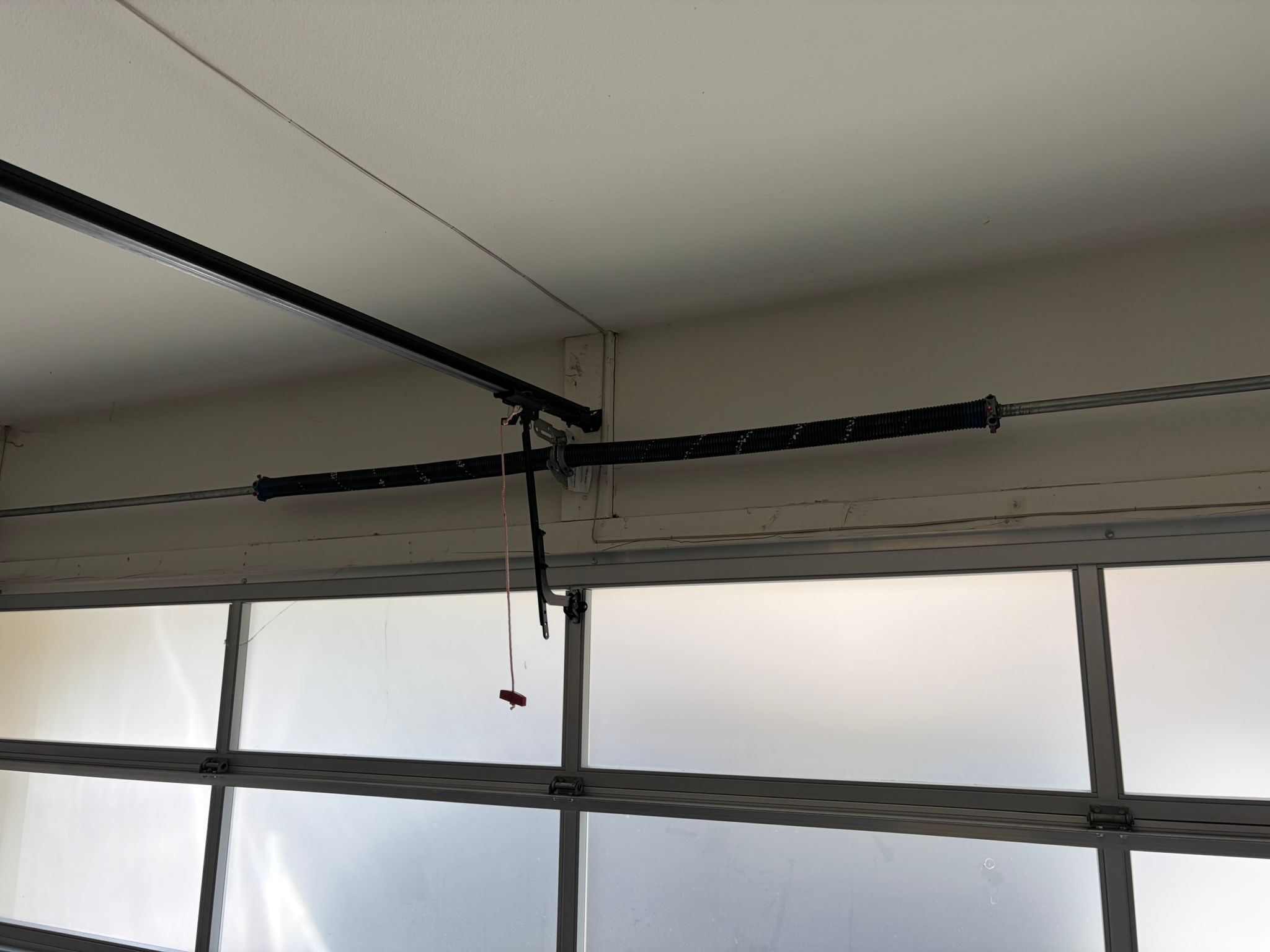 New spring on glass garage door