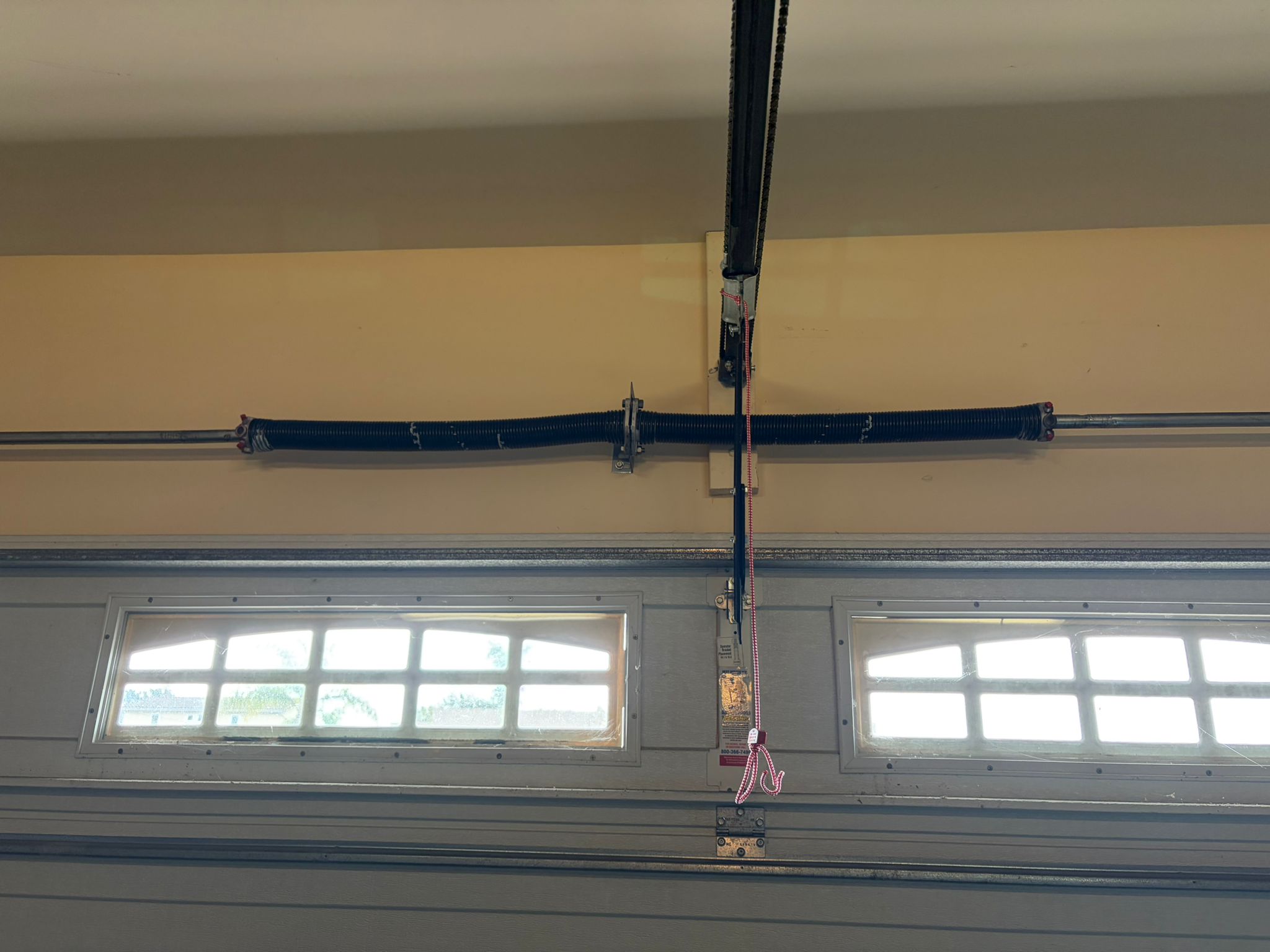 New spring on arch window garage door