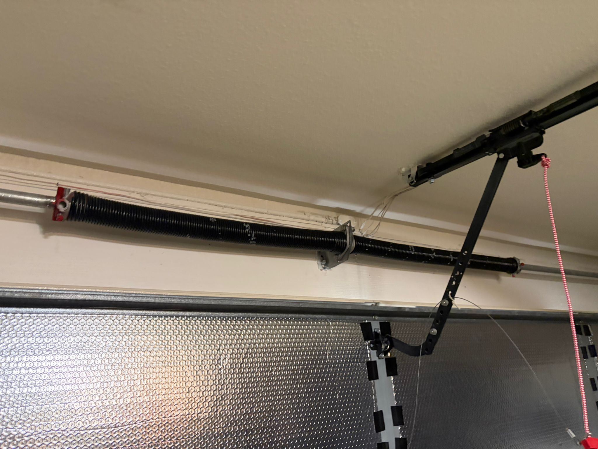 New spring installed on metallic door