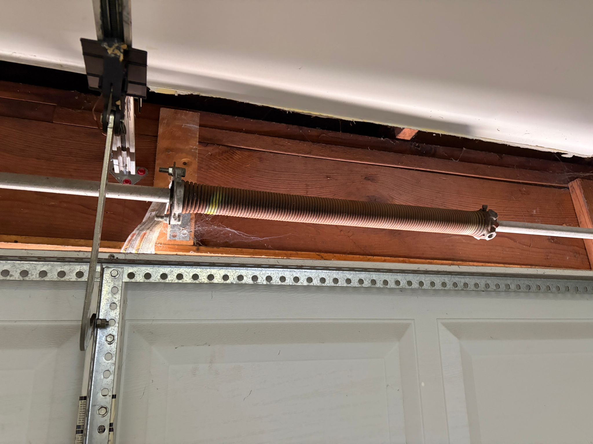 Old rusty garage door spring