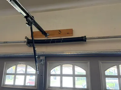 New spring on arched window garage door