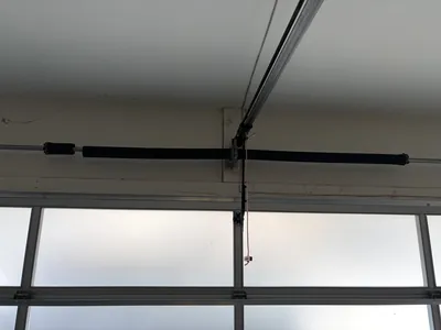 Old spring on glass panel garage door
