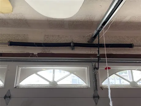 New garage door spring installed by Noah Garage Doors in San Diego