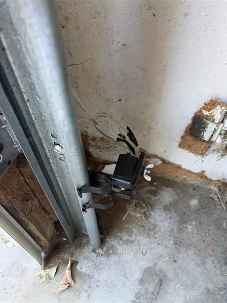 New garage door safety sensor installed by Noah Garage Doors in San Diego