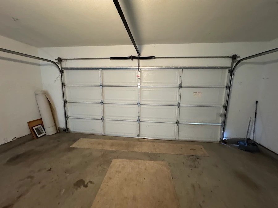 The same garage door back on track and closed after the repair by Noah Garage Doors, customer photo from a 5-star Google review