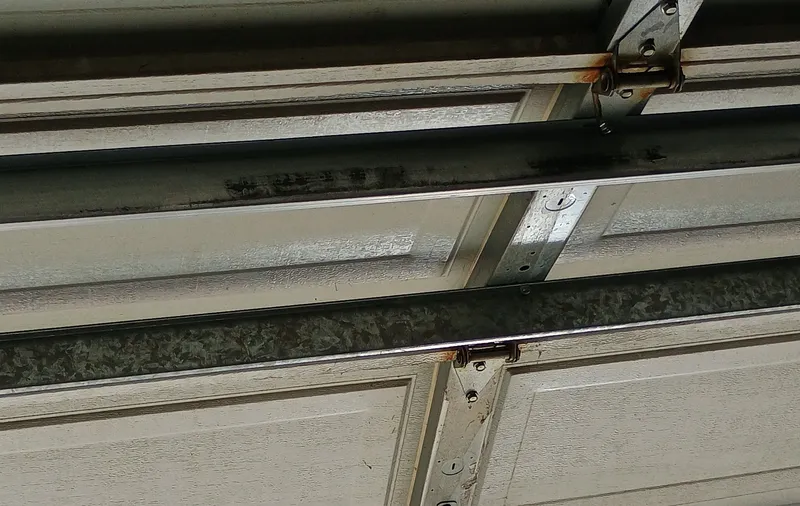 Garage door panels and hinges, customer photo from a 5-star Google review of Noah Garage Doors